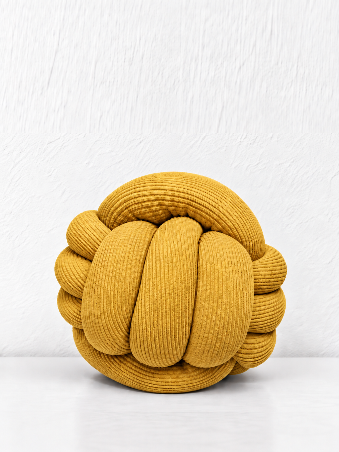 Coussin boule tressé
