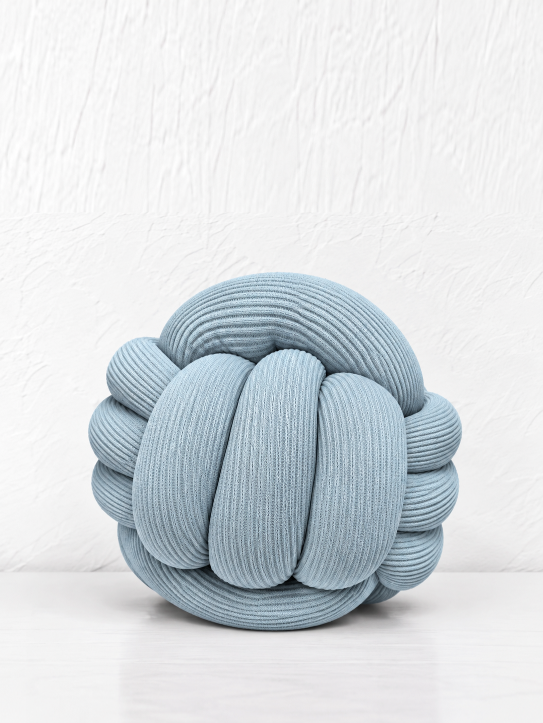 Coussin boule tressé